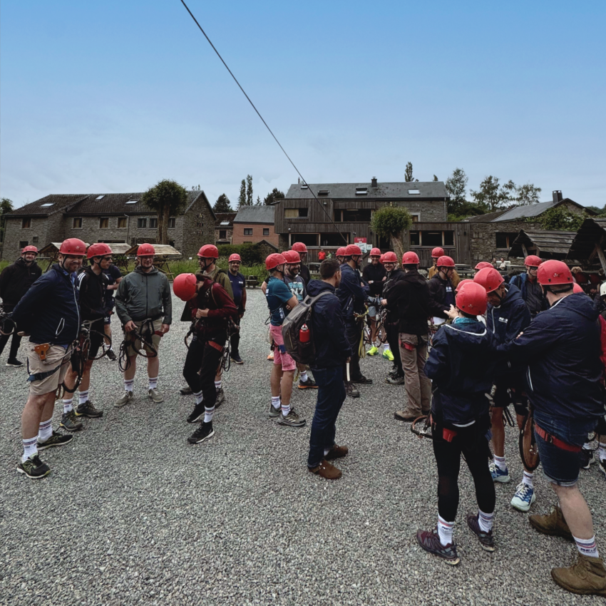 Group of REAZN employees wearing red helmets during a team-building activity