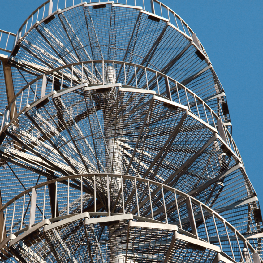 Galvanised spiral staircase with zinc-coated railings for industrial access