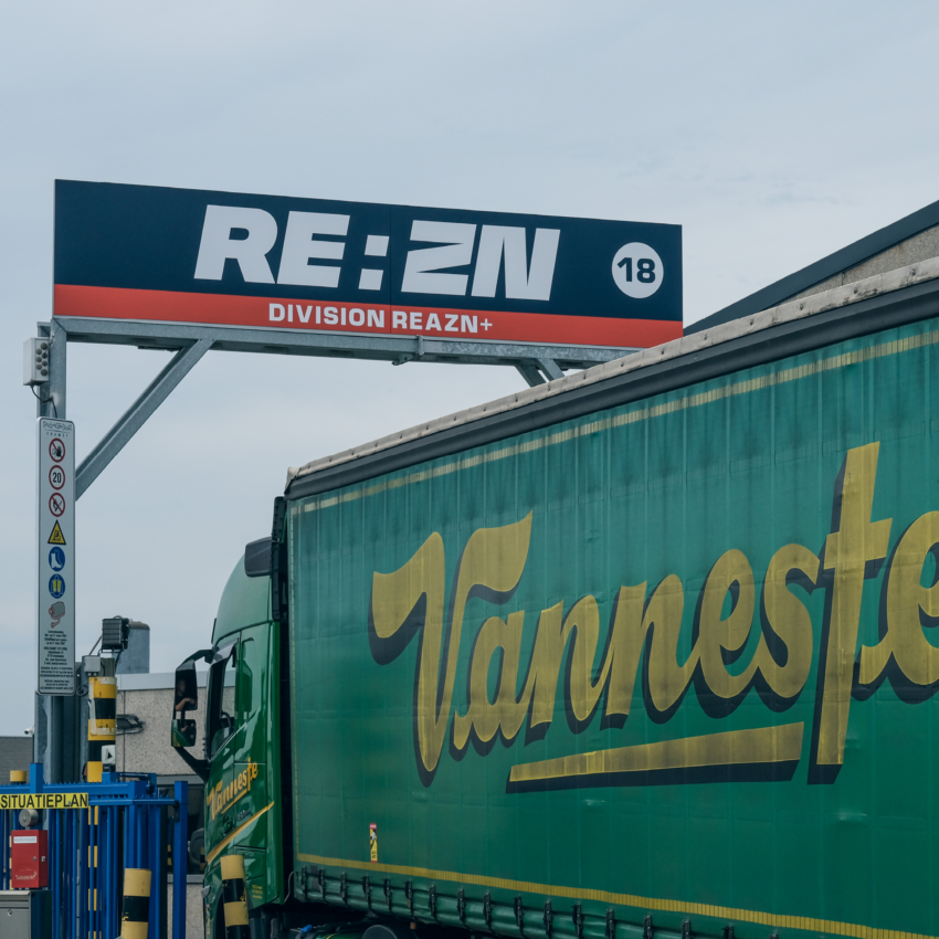 Truck with Vanneste branding at REAZN facility, showcasing logistics and material transport for zinc alloy production