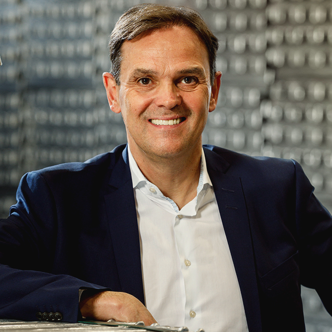 Portrait of Claude Bever, CEO at REAZN, leading zinc alloy innovations and sustainability initiatives